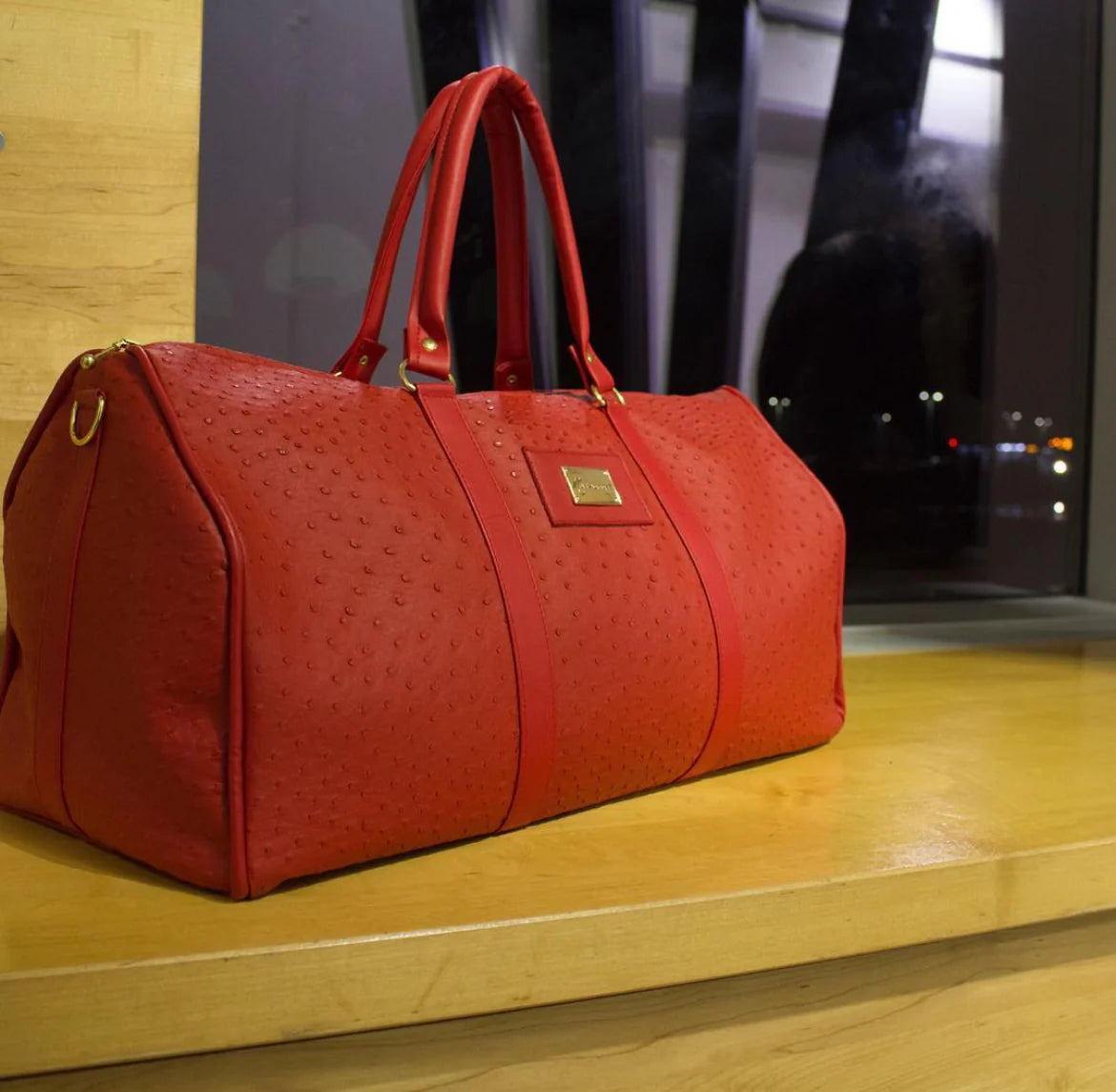 CRIMSON OSTRICH EMBOSSED DUFFLE BAG